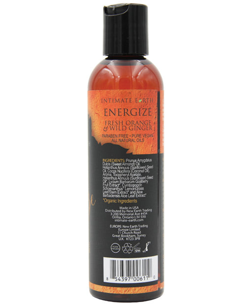 Aceite de masaje energizante de naranja y jengibre de Intimate Earth Product Image.