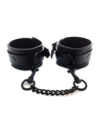 Rouge Black Leather Wrist Cuffs with Detachable Chain centered on a white background - featured product image.